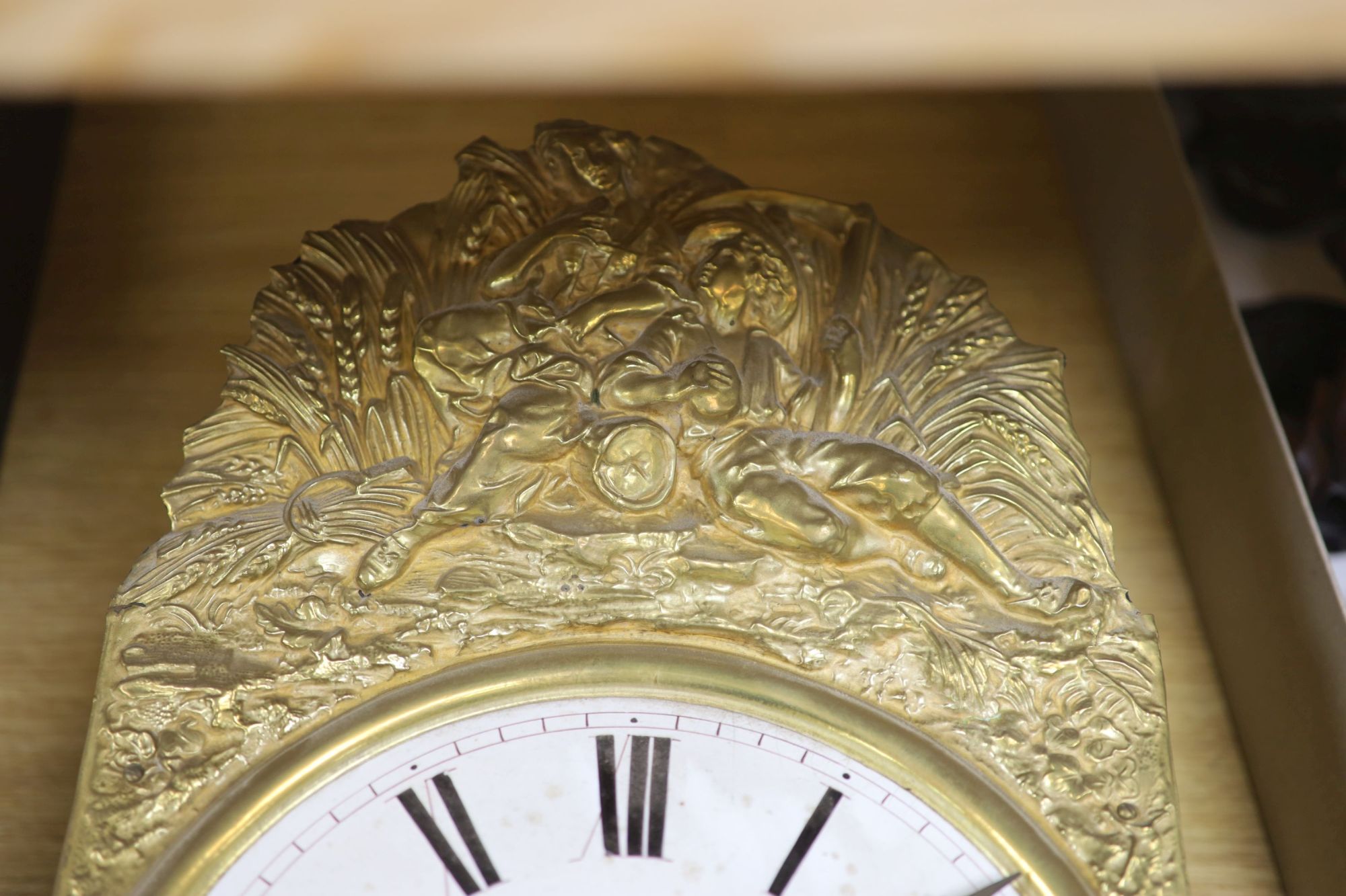 A 19th century French embossed brass wall clock, height 42cm